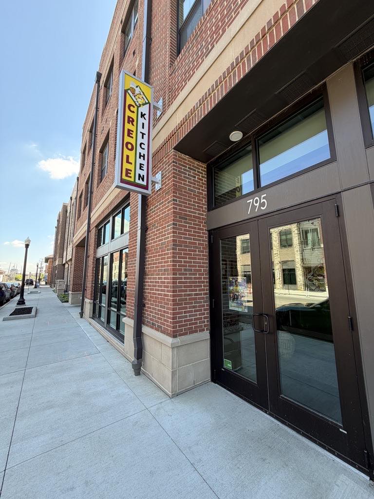 The Creole Kitchen sign hanging outside its King-Lincoln Bronzeville storefront